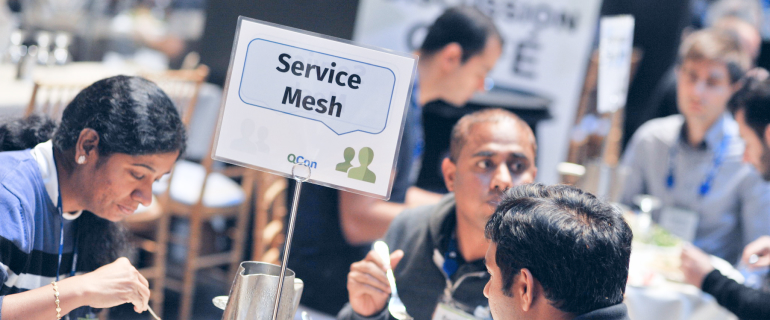 Attendees enjoying lunch at a Lunch Topic Discussion table